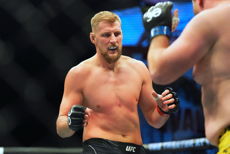 Mar 11, 2023; Las Vegas, Nevada, USA; Alexander Volkov (red gloves) fights Alexander Romanov (blue gloves) during UFC Fight Night at Virgin Hotel. Mandatory Credit: Ron Chenoy-USA TODAY Sports