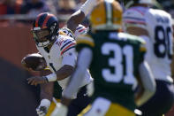 Chicago Bears quarterback Justin Fields carries the ball during the first half of an NFL football game against the Green Bay Packers Sunday, Oct. 17, 2021, in Chicago. (AP Photo/Nam Y. Huh)