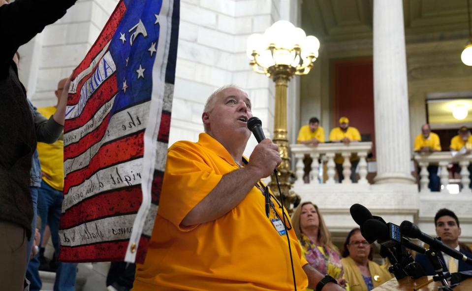 At a gun-rights rally at the State House in June 2022, Michael O'Neil, vice president of the Rhode Island Second Amendment Coalition, urges supporters to run for office so they can fight gun-control proposals.