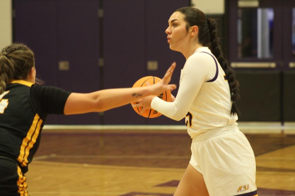 Ashland forward Hayley Smith looks for a teammate at the top of the key.
