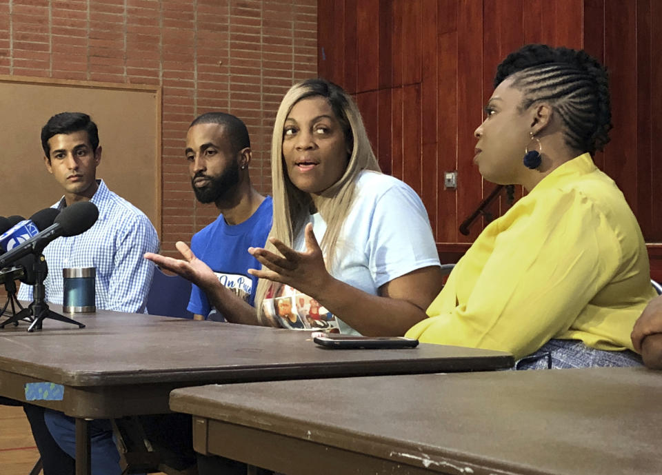In this Sept. 25, 2019 photo, LaTisha Nixon, second from right, talks about her son Gemmel Moore, one of the men who died in the apartment of Democratic donor Ed Buck, at a news conference in West Hollywood, Calif. From left are attorney Hussain Turk, Gemmel's friend Cory McLean, and advocate Jasmyne Cannick, right. It took more than two years from the first overdose death in political donor Buck's apartment until his arrest this month. In the time in between, another man died in the West Hollywood home, another had a close brush with death and several others reporting harrowing encounters with the gay white man who preyed on young black men to satisfy a drug-fueled sexual fetish. Activists who pushed for Buck's arrest wonder why it took so long to lock him up. (AP Photo/Brian Melley)