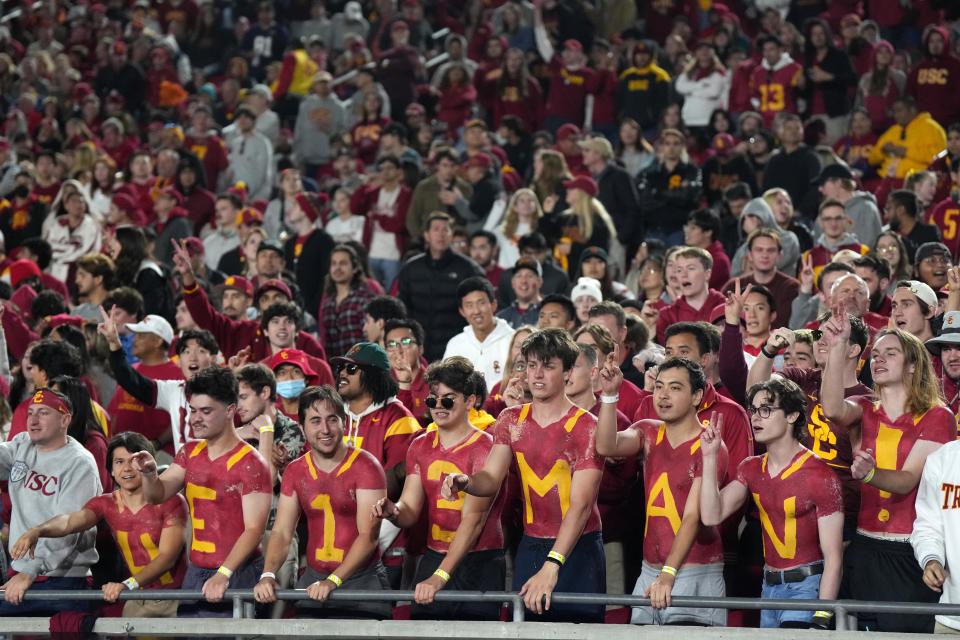 Fans of quarterback Caleb Williams spell out the word "Heisman" while incorporating his jersey number.