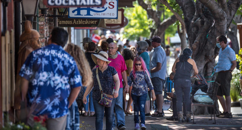 A crowd of people in California mingling in close proximity despite the rapid spread of coronavirus continuing. Source: Getty Images