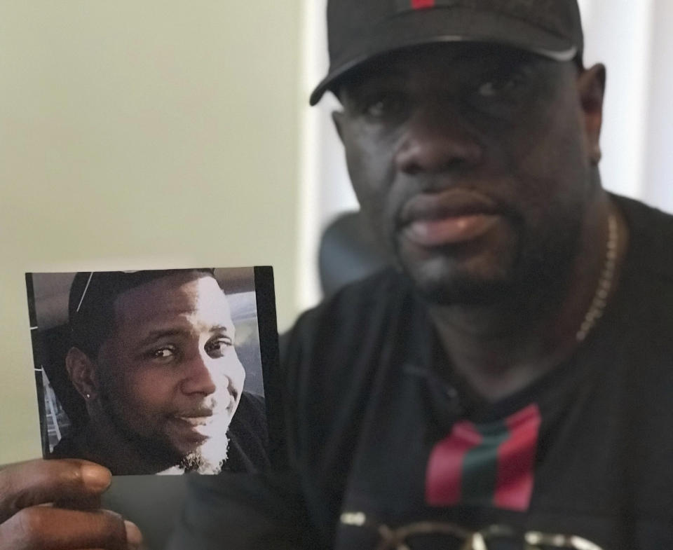 In this Aug. 7, 2018, file photo, Michael McGlockton holds a photo of his son, Markeis McGlockton, in Clearwater, Florida. (Photo: ASSOCIATED PRESS)