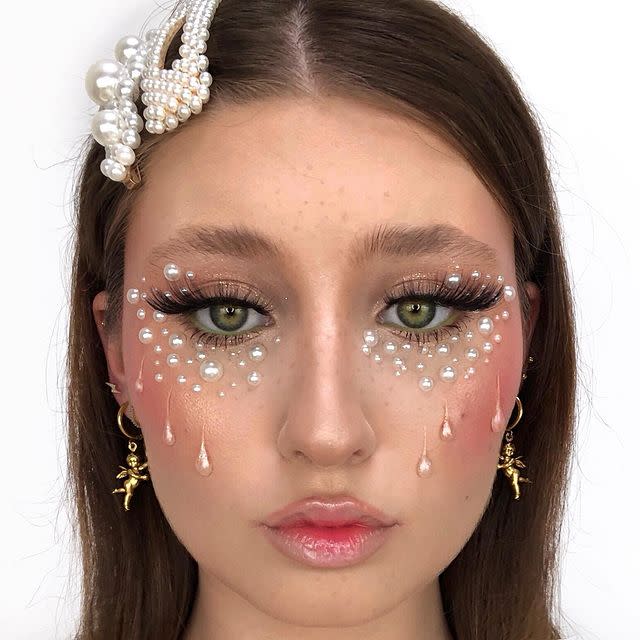 <p>Creepy doll make-up doesn't always have to be totally horrifying. Give yours a pretty twist with pearl embellishments in tear drop shapes. Finish with too many barrettes and far too much blusher and you've got AW19's update on the classic Halloween doll look.</p><p><a href="https://www.instagram.com/p/B0eM3JdH0sx/" rel="nofollow noopener" target="_blank" data-ylk="slk:See the original post on Instagram;elm:context_link;itc:0;sec:content-canvas" class="link ">See the original post on Instagram</a></p>