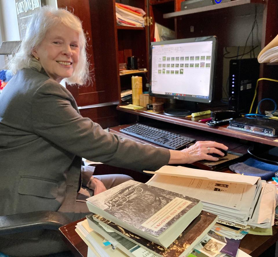 Author Karen Dove Barr at her desk where she wrote and researched "Burnt Pot Island."