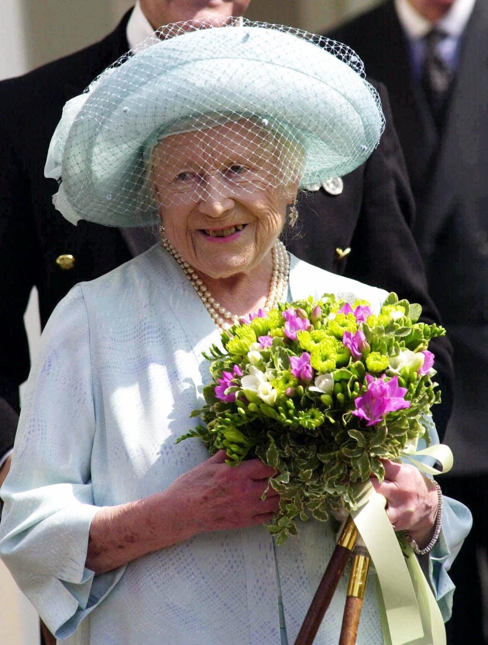 FILE - In this Friday, Aug. 4, 2000 file photo, Britain's Queen Elizabeth, The Queen Mother appears at the main gates to Clarence House, in London, before taking the Salute on her 100th birthday. Prince Philip was the longest serving royal consort in British history. In Britain, the husband or wife of the monarch is known as consort, a position that carries immense prestige but has no constitutional role. The wife of King George VI, who outlived him by 50 years, was loved as the Queen Mother. (Rebecca Naden/pool via AP, File)