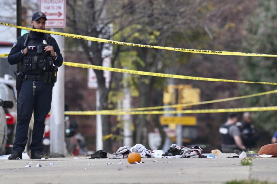 Police work at the scene of a shooting Tuesday afternoon, Nov. 7, 2023, in southwest Baltimore. Officers shot and killed a man after he allegedly pointed a gun at them. (Jerry Jackson/The Baltimore Sun via AP)