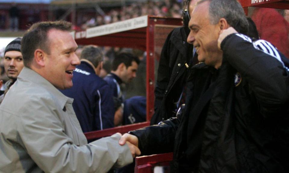 Managers Simon Davey and Avram Grant shake hands before the match.