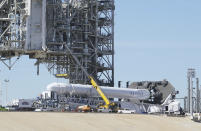 A Space X Falcon9 rocket is readied for launch Friday, Feb. 17, 2017, at Launch Complex 39A at the Kennedy Space Center in Cape Canaveral, Fla. Saturday morning's planned launch will be SpaceX's first from Florida since a rocket explosion at another pad last summer. (Red Huber/Orlando Sentinel via AP)