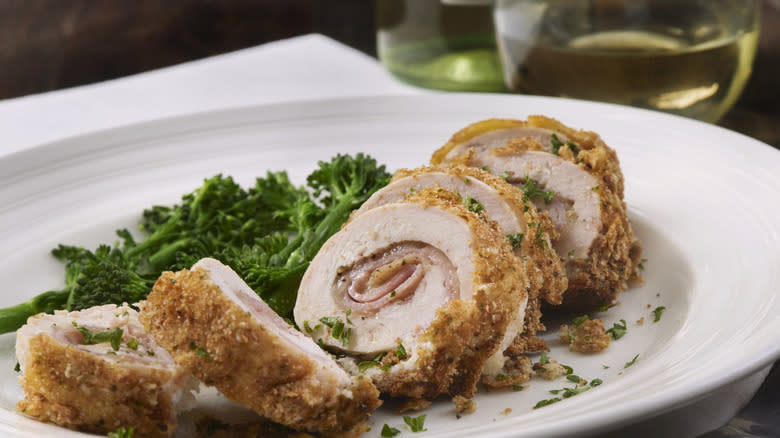 chicken cordon bleu on plate with vegetables