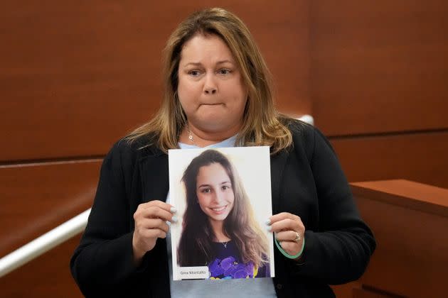 Jennifer Montalto holds a picture of her daughter, Gina, before giving her victim impact statement during the penalty phase last August. (Photo: Pool via Getty Images)