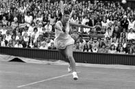 FILE - In this June 28, 1973, file photo, Australia's Kerry Melville makes a return against Ilana Kloss, of South Africa, during a match at Wimbledon. It’s the 50th anniversary of Billie Jean King and eight other women breaking away from the tennis establishment in 1970 and signing a $1 contract to form the Virginia Slims circuit. That led to the WTA Tour, which offers millions in prize money. Melville was one of the nine. (AP Photo/Bob Dear, File)