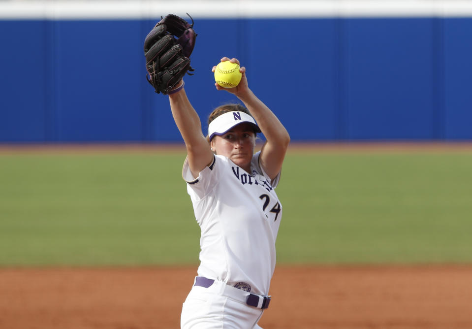 FILE - Northwestern's Danielle Williams pitches in the first inning of an NCAA softball Women's College World Series game against UCLA, in Oklahoma City on June 3, 2022. (AP Photo/Alonzo Adams, File)