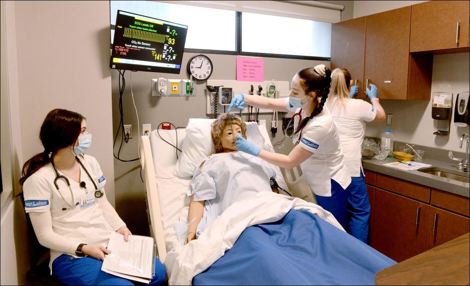 Students McKayla Moore, left, of Farmington and Allyssa Richmond of Canandaigua participate in a nursing simulation at the Finger Lakes Community College main campus on March 7, 2022.