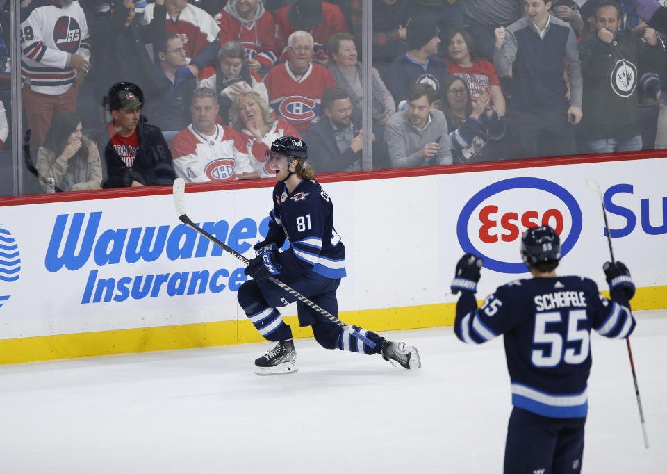 Winnipeg Jets' Kyle Connor (81) celebrates his overtime goal against the Montreal Canadiens during an NHL hockey game Thursday, Nov. 3, 2022, in Winnipeg, Manitoba. (John Woods/The Canadian Press via AP)