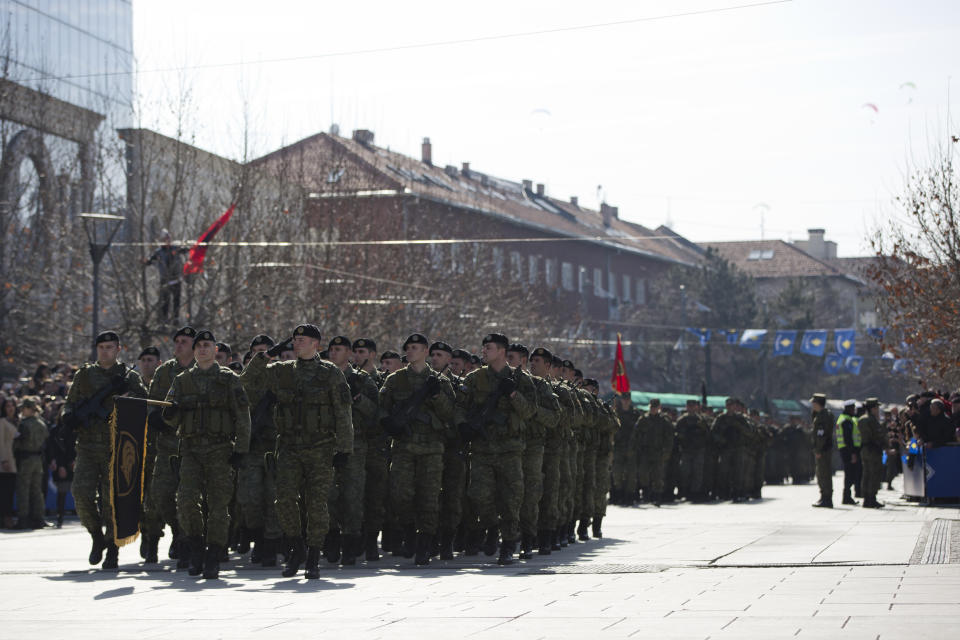 Kosovo Security Force members march during celebrations to mark the 11th anniversary of independence, in Pristina, Sunday, Feb. 17, 2019. Thousands of civilians filled downtown Pristina Sunday decorated with national and U.S. flags while infantry troops with light weaponry of the Kosovo Security Forces, now transformed into a regular army, paraded as a “professional, multiethnic army serving the youngest country in the world,” as President Hashim Thaci said. (AP Photo/Visar Kryeziu)