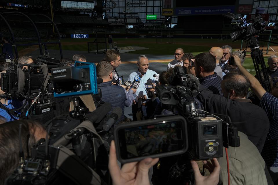 Major League Baseball Commissioner Rob Manfred answers quesions before a baseball game between the Milwaukee Brewers and the San Francisco Giants Thursday, May 25, 2023, in Milwaukee. (AP Photo/Morry Gash)