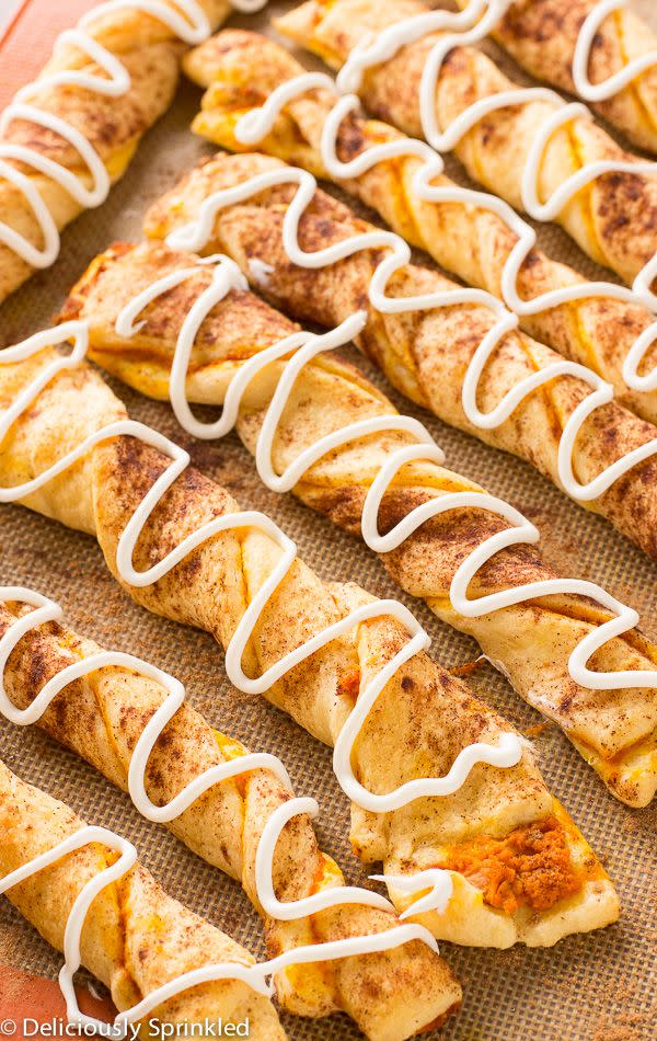 <p>Sandwich pumpkin puree between two crescent rolls, topping with pumpkin pie spice before twisting and baking for a quick 8-10 minutes.</p><p><strong>Get the recipe at <a href="http://deliciouslysprinkled.com/pumpkin-pie-twists/" rel="nofollow noopener" target="_blank" data-ylk="slk:Deliciously Sprinkled;elm:context_link;itc:0;sec:content-canvas" class="link ">Deliciously Sprinkled</a>.</strong></p>