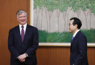 U.S. Deputy Secretary of State Stephen Biegun, left, is greeted by his South Korean counterpart Lee Do-hoon during their meeting at the Foreign Ministry in Seoul Wednesday, July 8, 2020. Biegun is in Seoul to hold talks with South Korean officials about allied cooperation on issues including North Korea. (Kim Hong-ji/Pool Photo via AP)