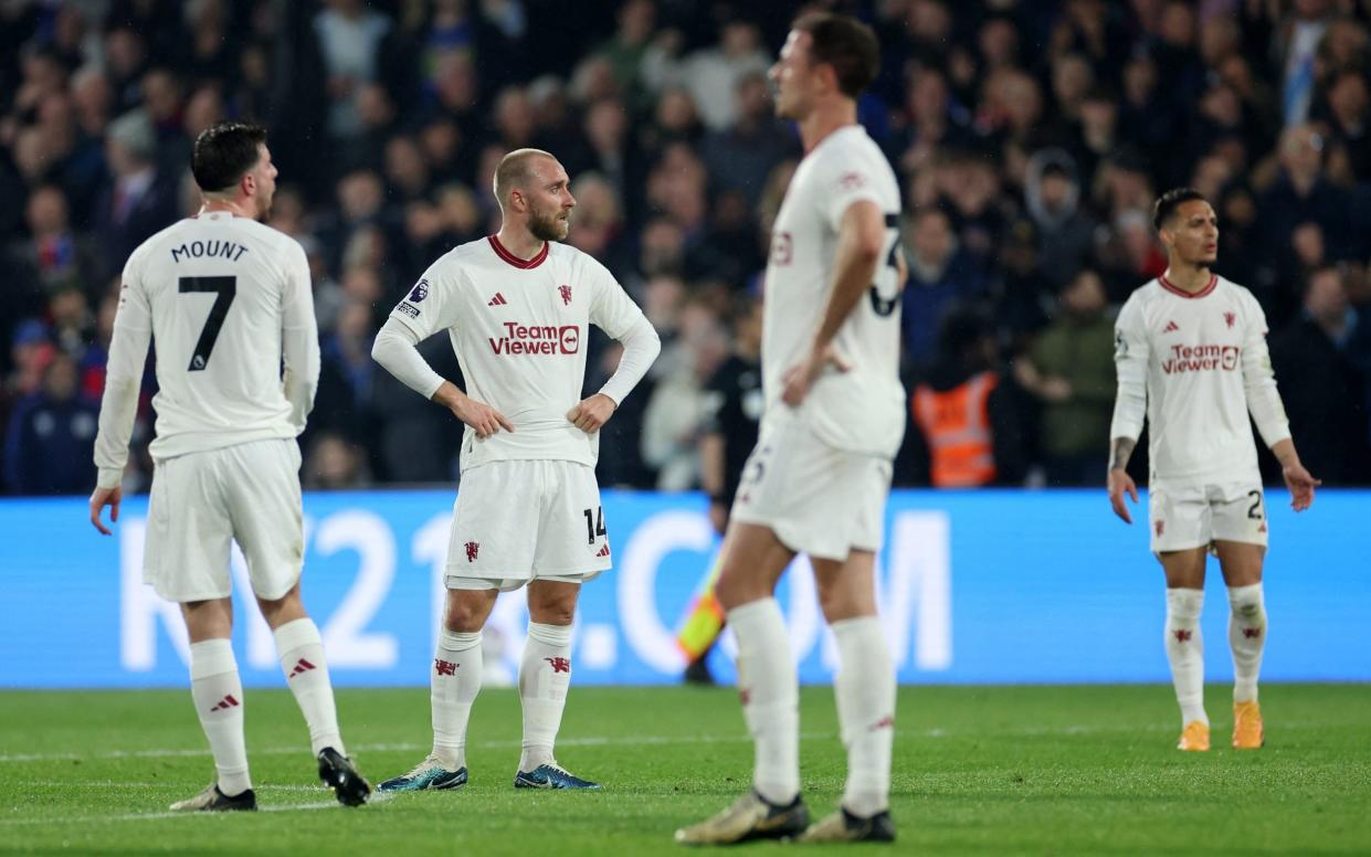 Manchester United's Christian Eriksen and teammates look dejected after Crystal Palace's Jean-Philippe Mateta