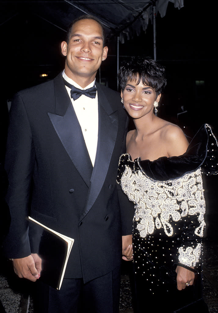 <p>Berry married David Justice on New Year’s Eve 1993 after six months of dating. The actress referred to the Atlanta Braves outfielder as her <a rel="nofollow noopener" href="http://www.people.com/people/archive/article/0,,20141276,00.html" target="_blank" data-ylk="slk:“prince on a white horse.”;elm:context_link;itc:0;sec:content-canvas" class="link ">“prince on a white horse.”</a> Months later, Justice was by Berry’s side, celebrating her casting as a secretary in <i>The Flintstones</i>, a role originally intended for a blonde. However, their relationship was filled with drama. (Photo: Ron Galella/WireImage) </p>