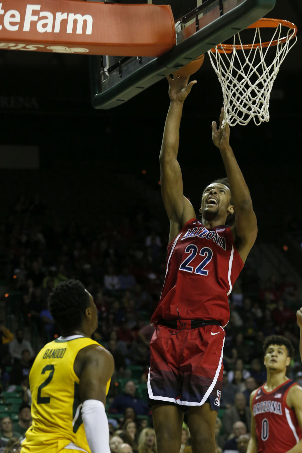 Arizona forward Zeke Nnaji (22) scores in front of Baylor guard Devonte Bandoo (2) during the first half of an NCAA college basketball game in Waco, Texas, Saturday, Dec. 7, 2019. (AP Photo/Michael Ainsworth)