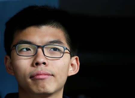 Former student leader Joshua Wong reacts outside High Court before receiving his sentence in Hong Kong, China January 17, 2018. REUTERS/Bobby Yip