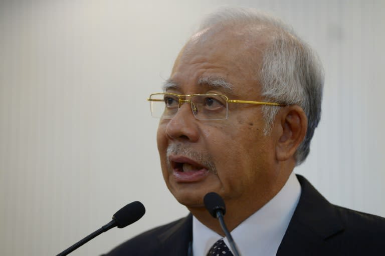 Malaysia's Prime Minister Najib Razak delivers a statement on the missing Malaysia Airlines flight MH370 in Kuala Lumpur early on August 6, 2015