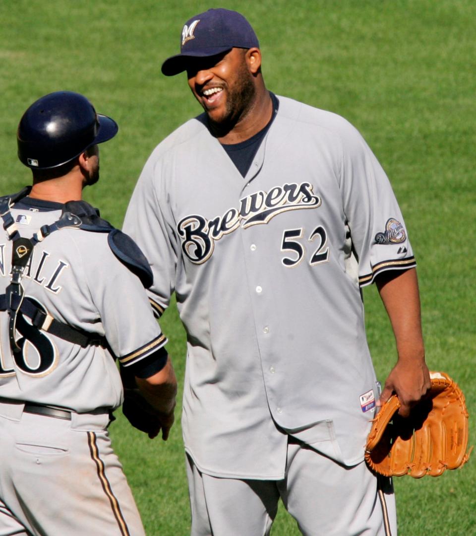 Milwaukee Brewers pitcher CC Sabathia celebrates with catcher Jason Kendall after throwing a complete game one-hitter against the Pittsburgh Pirates.