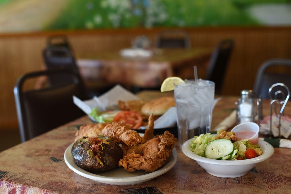 A Gil's Supper Club chicken dinner and famous pork tenderloin are pictured here.