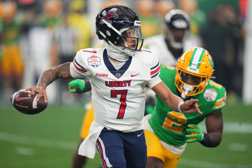 Liberty quarterback Kaidon Salter (7) scrambles during the first half on the NCAA Fiesta Bowl college football game against Oregon Monday, Jan. 1, 2024, in Glendale, Ariz.