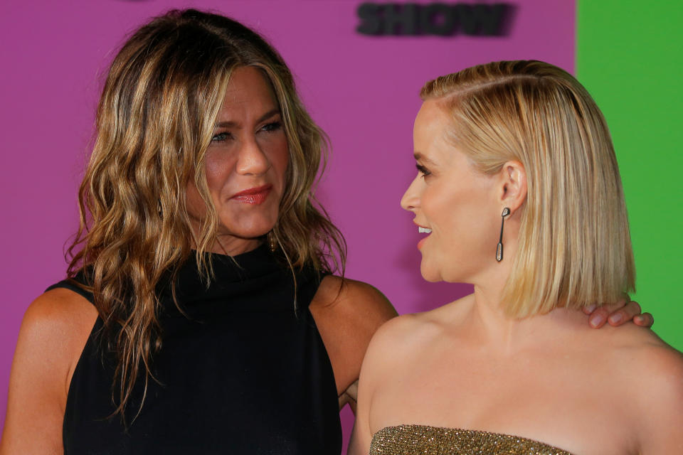 Reese Witherspoon (R) and Jennifer Aniston arrive to the global premiere for Apple's 