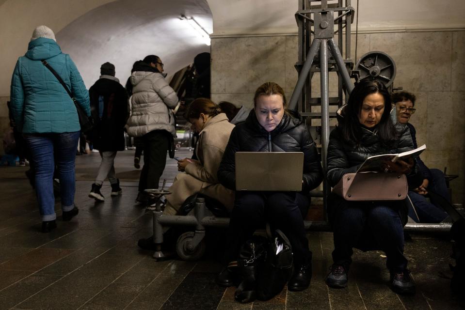 Kyiv residents work in an underground metro station during a two hour air alarm on October 20, 2022 in Kyiv, Ukraine. Increased air alarms are becoming more commonplace with the recent drone strikes hitting the capitol city. Restricted power supplies and limited electricity started today so that energy companies could repair power facilities hit by a wave of recent Russian air strikes.