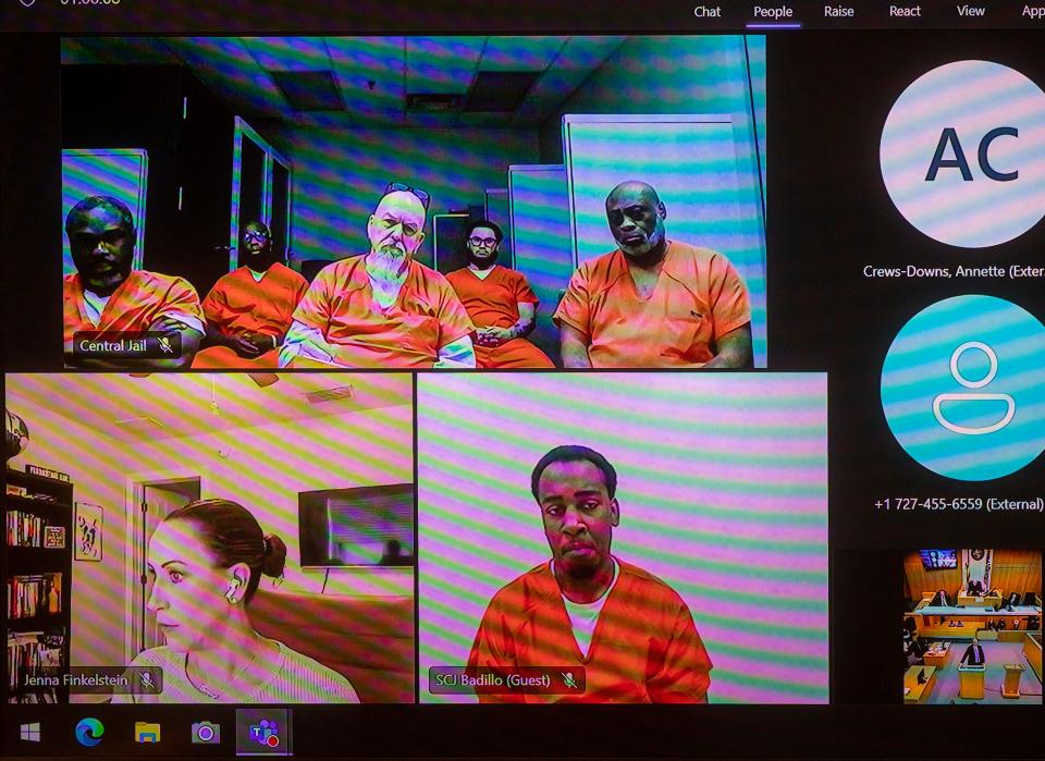 Other first-degree murder defendants, including David Marshall Murdock, top center, listen to a hearing before Judge J. 
Kevin Abdoney on Tuesday.