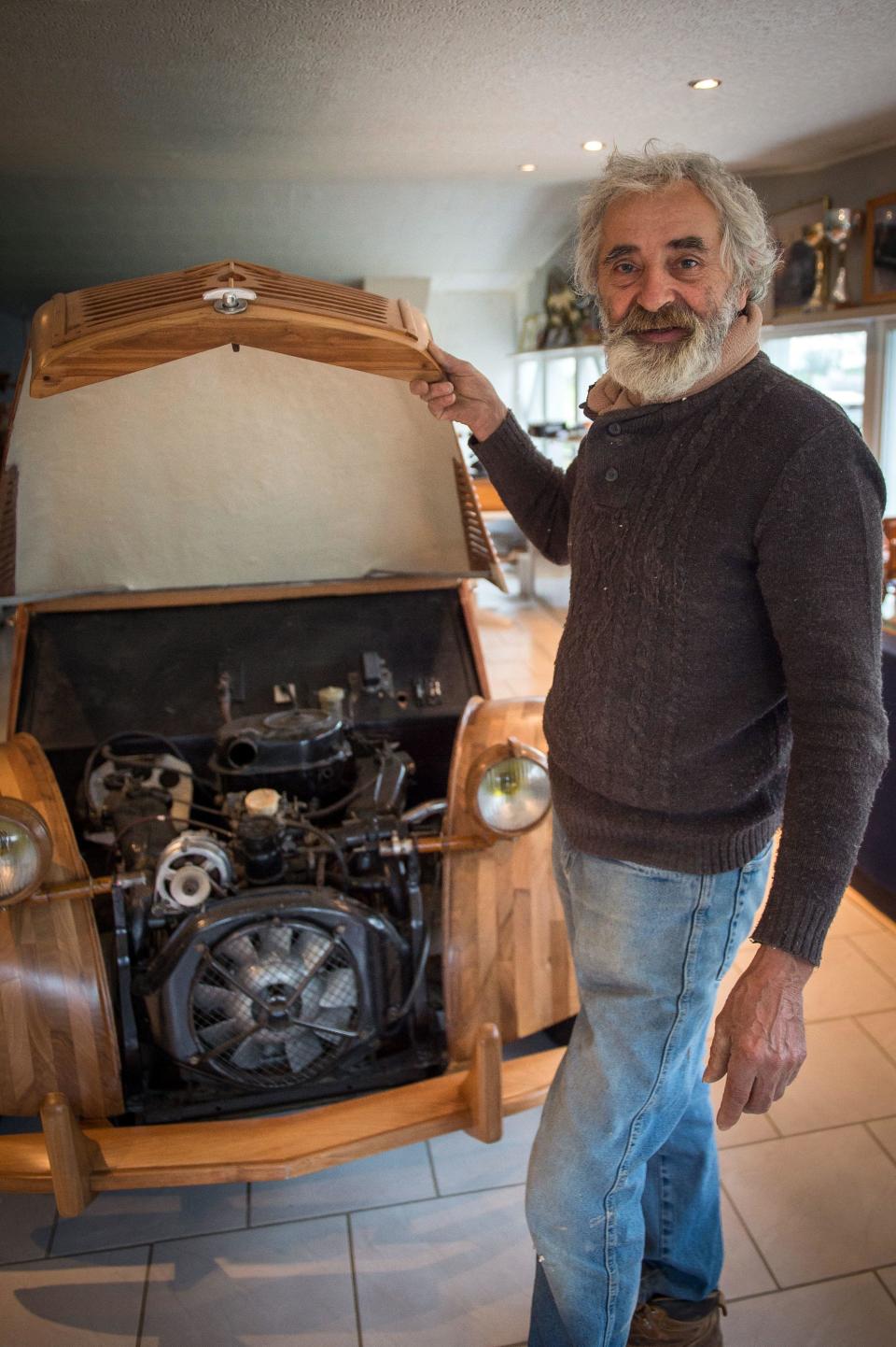 French cabinetmaker Michel Robillard shows the details of his handbuilt wooden Citroen   2CV car, built as an exact replica, March 20, 2017, near Loches, France. / Credit: GUILLAUME SOUVANT/AFP/Getty