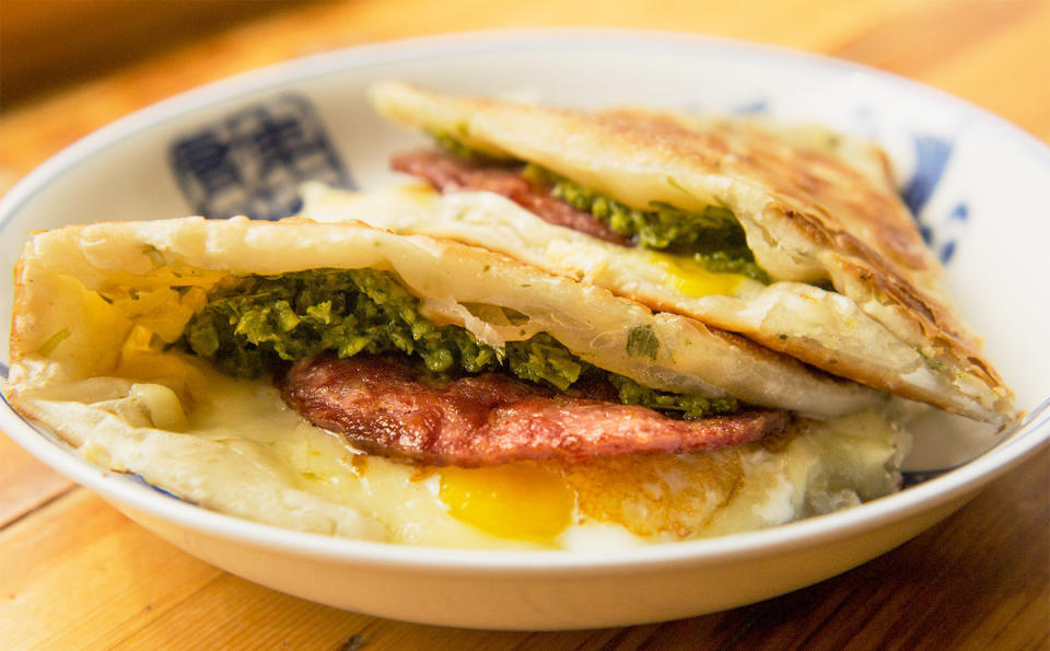 Mei Mei's Double Awesome:&nbsp;an herbaceous, savory, handheld scallion pancake smothered in a local greens pesto and filled with two soft eggs and Vermont cheese.&nbsp; (Photo: Mei Mei)