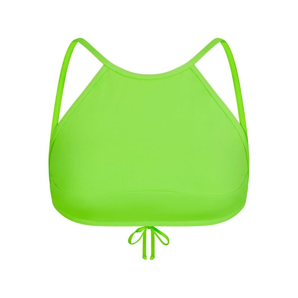 <p><a href="https://go.redirectingat.com?id=74968X1596630&url=https%3A%2F%2Fskims.com%2Fproducts%2Fswim-high-neck-top-neon-green&sref=https%3A%2F%2Fwww.cosmopolitan.com%2Fentertainment%2Fcelebs%2Fa43450581%2Fkim-kardashian-thong-bikini-pictures%2F" rel="nofollow noopener" target="_blank" data-ylk="slk:Shop Now;elm:context_link;itc:0;sec:content-canvas" class="link ">Shop Now</a></p><p>SWIM HIGH NECK TOP</p><p>$48.00</p><p>skims.com</p>