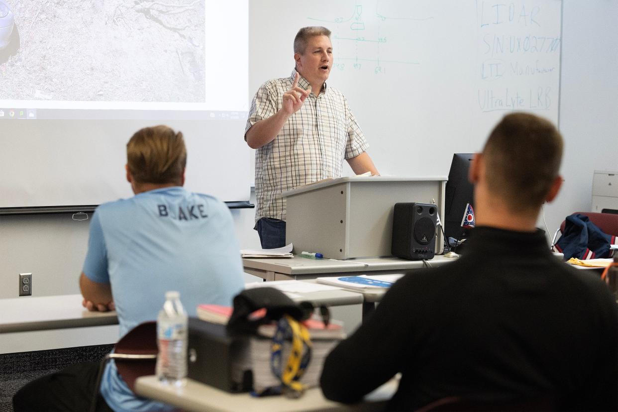 Jerry Snay, commander of the Stark State College law enforcement academy, teaches class in this file photo from 2023.