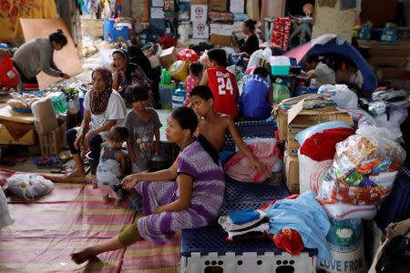 Evacuated residents rest at an evacuation centre in Iligan, while government forces fight insurgents from the Maute group in Marawi, Philippines June 27, 2017. REUTERS/Jorge Silva