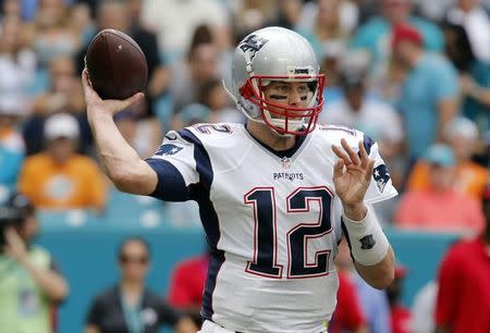 Jan 1, 2017; Miami Gardens, FL, USA; New England Patriots quarterback Tom Brady (12) throws a pass during the first quarter of an NFL football game against the Miami Dolphins at Hard Rock Stadium. Mandatory Credit: Reinhold Matay-USA TODAY Sports