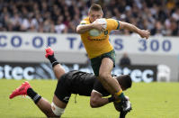 Australia's James O'Connor is tackled by New Zealand's Tupou Vaa'i during the second Bledisloe Rugby test between the All Blacks and the Wallabies at Eden Park in Auckland, New Zealand, Sunday, Oct. 18, 2020. (AP Photo/Mark Baker)