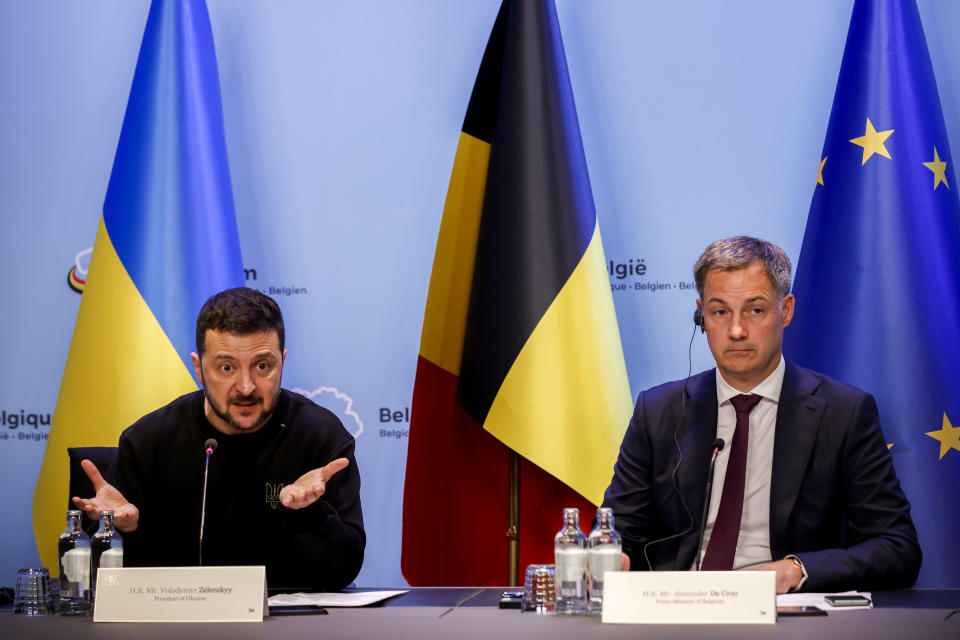 Ukraine's President Volodymyr Zelenskyy, left, talks to journalists during a joint news conference with Belgium's Prime Minister Alexander De Croo following their meeting at the prime ministers' office in Brussels, Tuesday, May 28, 2024. (AP Photo/Omar Havana)