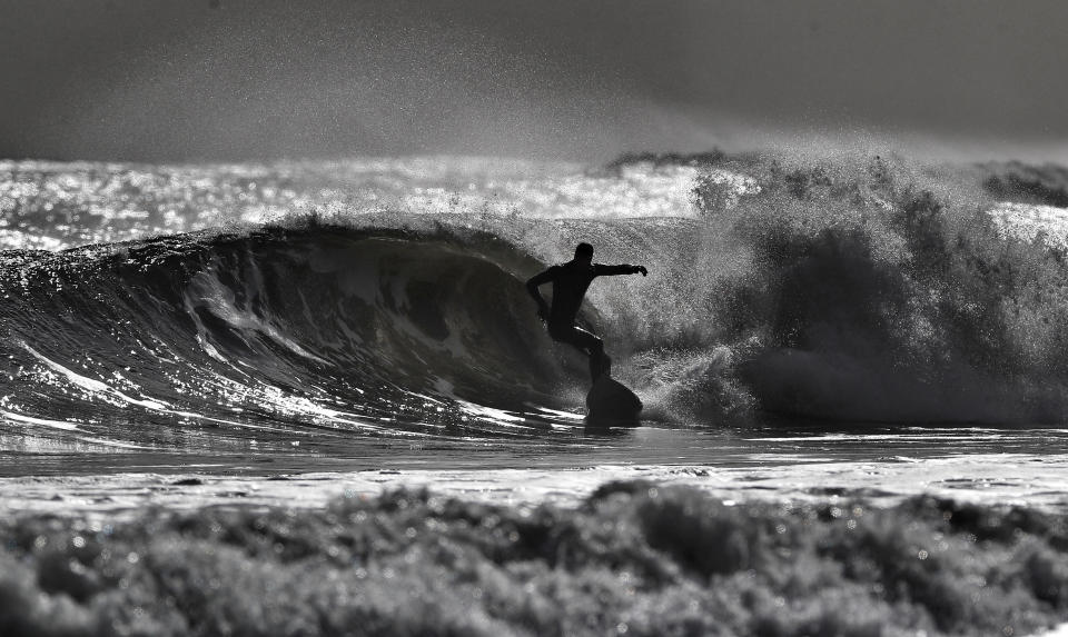 Only the hardiest and bravest surfers defied the lockdown (Owen Humphreys/PA)