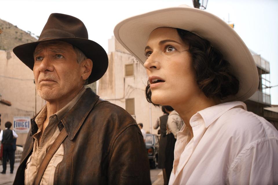 (L-R): Indiana Jones (Harrison Ford) and Helena (Phoebe Waller-Bridge) in Lucasfilm's INDIANA JONES AND THE DIAL OF DESTINY