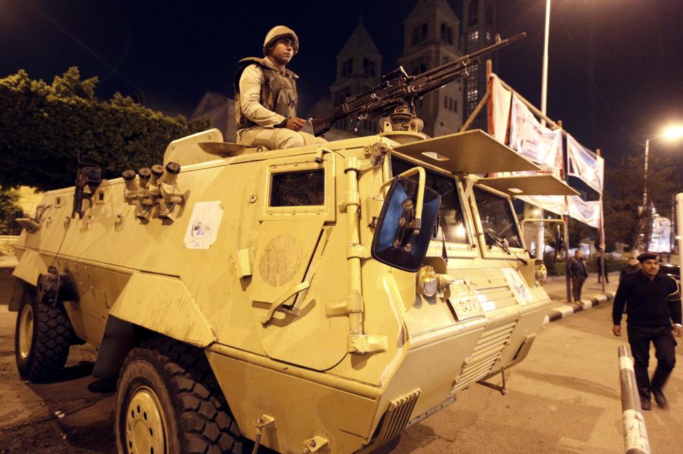 Army soldiers guard the streets during a Coptic Christmas eve mass at the main cathedral in Cairo