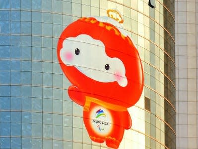 Bing Dwen Dwen and Shuey Rhon Rhon, mascots of the Beijing 2022 Winter Olympics and Paralympics displayed on a building in Beijing, China.