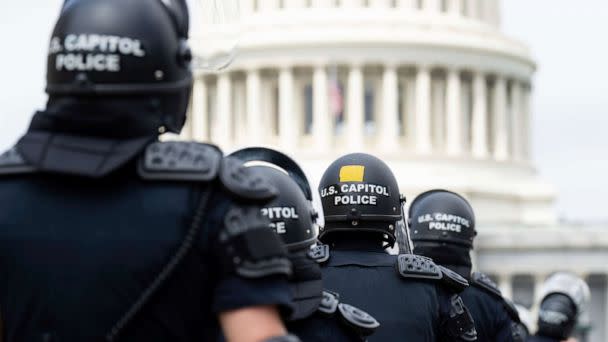 PHOTO: U.S. Capitol Police in riot gear return to their staging area after clear a path back to the Capitol, June 24, 2022. (Bill Clark/AP, FILE)