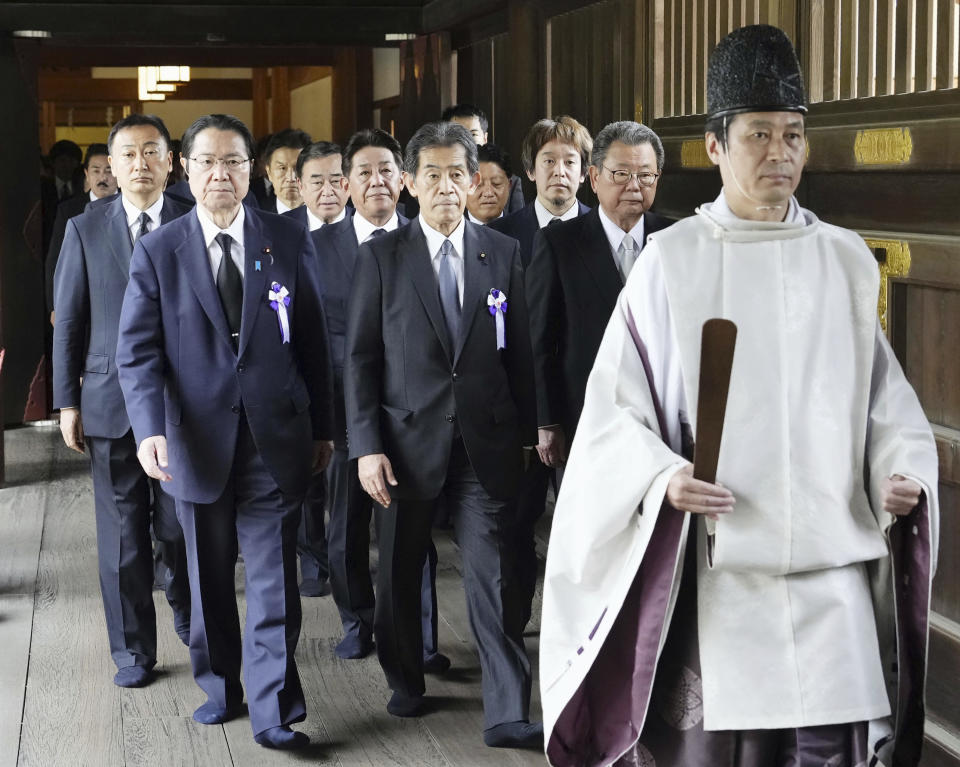 Japanese lawmakers visit the Yasukuni Shrine in Tokyo to offer prayers to the war dead, Tuesday, Aug. 15, 2023. Japan holds annual memorial service for the war dead as the country marks the 78th anniversary of its defeat in the World War II. (Kyodo News via AP)