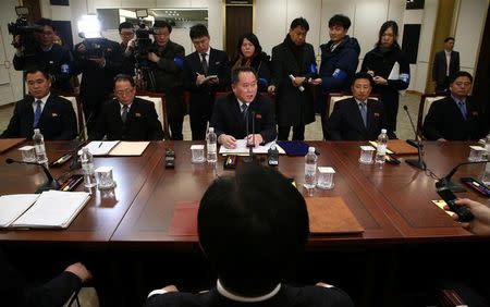 Head of the North Korean delegation, Ri Son Gwon talks with South Korean counterpart Cho Myoung-gyon during their meeting at the truce village of Panmunjom in the demilitarised zone separating the two Koreas, South Korea, January 9, 2018. REUTERS/Korea Pool/Files